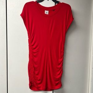 Cabi brand red stretch tunic dress with gathers on the sides.